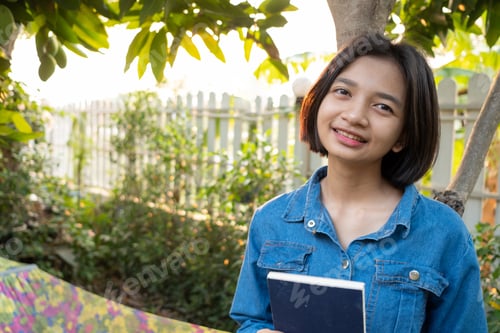 Preview: Happy Young Asian Girl Spend Time In The Garden At Home.