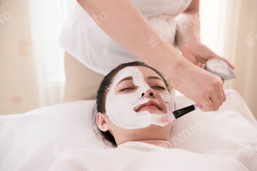 Preview: Close Up Young Asian Woman Apply Cream With Brush Mask On Face In Spa Beauty Salon. Skin Care And