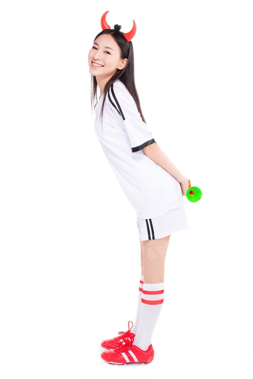 Preview: Uniformed Cheerleader A Pose With A Megaphone Isolated On White.