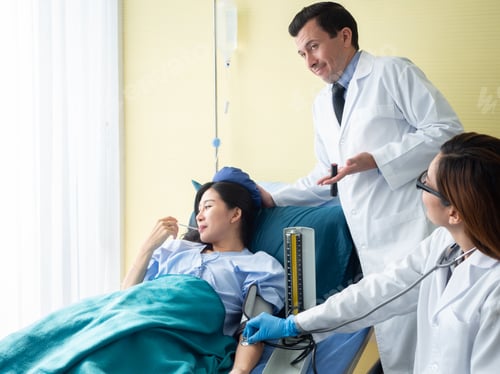 Preview: Doctor And Patient Concept.Smiley Doctor Tack Care Illness In Hospital