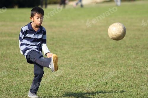 Preview: Japanese Boy Playing With Soccer Ball (Second Grade At Elementary School)