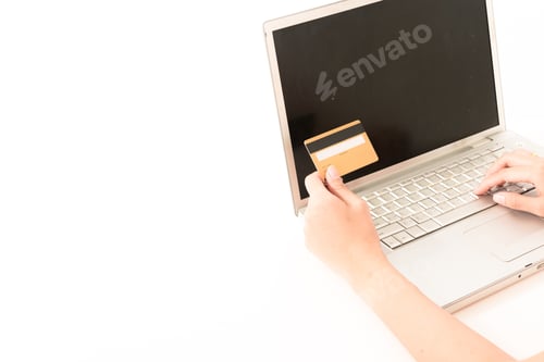 Preview: Asian Woman Holding A Gold Credit Card In Modern Home Isolated On White Background. For Mixed