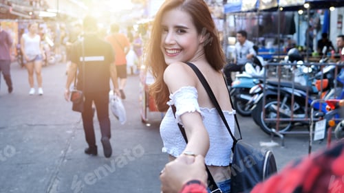 Preview: Beautiful Young Woman Caucasian Holding Man'S Hand And And Leading Him On Khaosan Road Walking