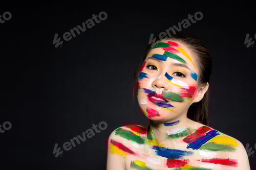 Preview: Body Art Abstract Make Up With Sad Happy Face. Portrait Of Beautiful Young Asian Woman With