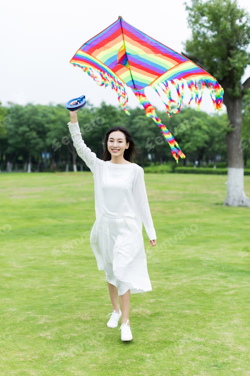 Preview: Beautiful Asian Girl, Holding A Kite In The Park Ready To Fly