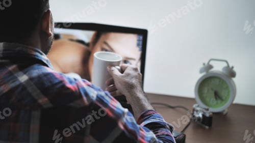Preview: Back View Of Male Photographer Working At Home On Laptop, Retouching Photos