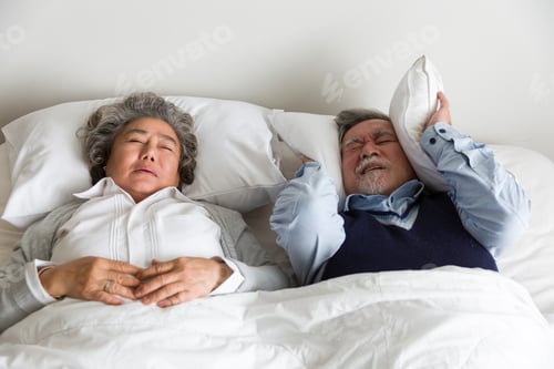 Preview: Senior Elderly Woman Sleeping And Snoring On The Bed With White Blanket, Pillow In The Bedroom At
