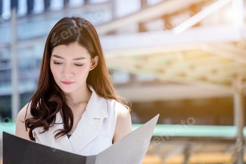 Preview: The Asian Business Woman Working And Operation In Outside Office With Building And City Background.