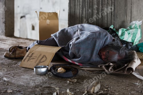 Preview: Homeless And Hungry Man Sleeping At Abandoned Building Or On Street With Signboard For Help And