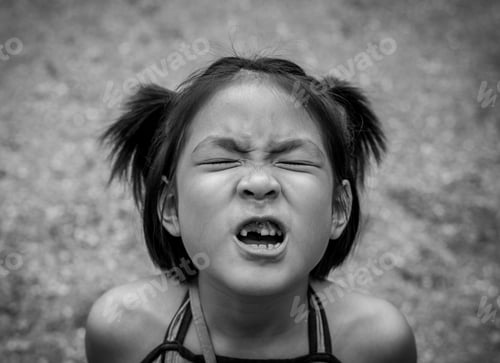 Preview: Closeup Little Asian Girl With A Broken Teeth