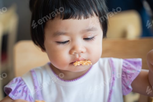 Preview: Cute Baby Eating Ice Cream At The Restaurant