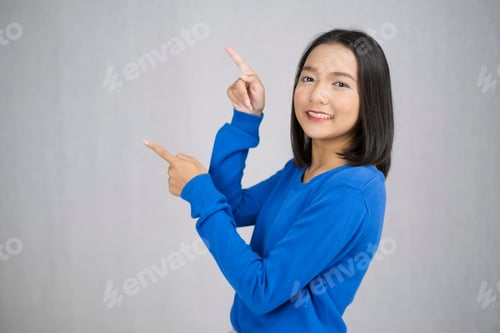 Preview: Happy Young Girl Wear Blue Sweater Standing With Gray Background.