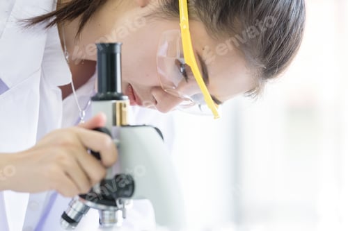 Preview: Asian Young Student Scientist Researching With A Microscope In A Laboratory.