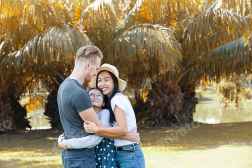 Preview: Daughter Hugging Mother And Father Outdoors In Summer Garden, Valentine Concept