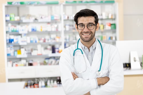 Preview: Portrait Of Middle Eastern Male Pharmacist Standing Arms Crossed And Smile Looking Camera With