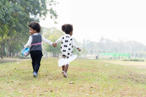 Preview: African American Little Boy And Girl Holding Dustpan And Collecting Trash Into A Bag. Group Of Afro