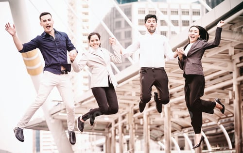 Preview: Young Business Team Jumping For Huge Celebration Of Successful Team Work. Taken Outdoor In