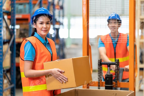 Preview: Group Of Asian Young Male And Female Employee Warehouse Worker In Safety Vest And Helmet Moving Or