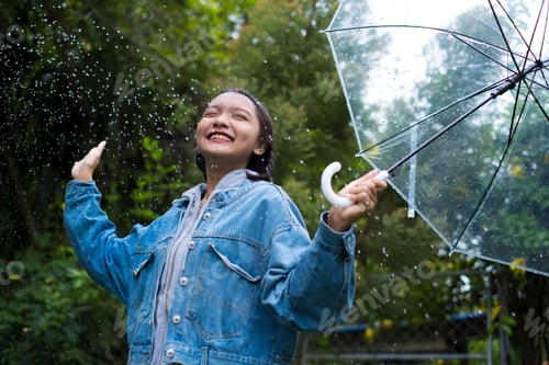 Preview: Happy Young Girl Playing With Rain In Green Garden.