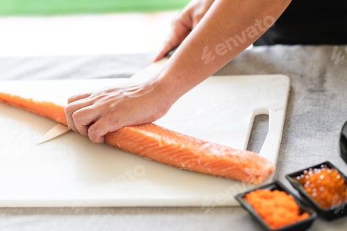 Preview: Cutting Salmon for Sushi Preparation in Kitchen