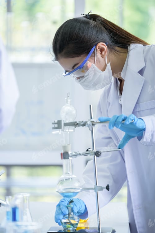Preview: Asian Young Girl Student Scientist Researching And Learning In A Laboratory.