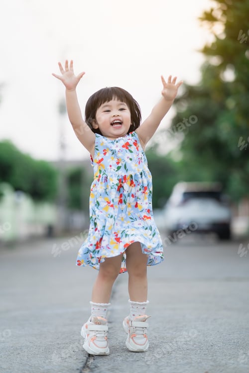 Preview: Happy Cute Girl Smiling And Jumping On The Road