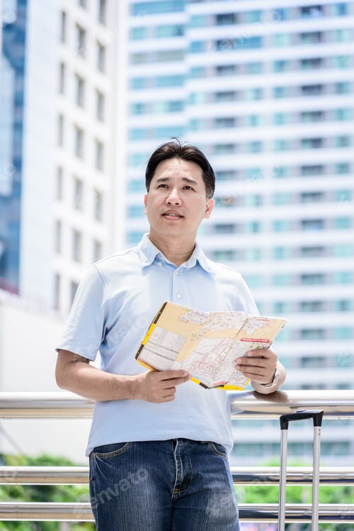 Preview: Asian Adult Tourist Has Looking And Planning To Travel.