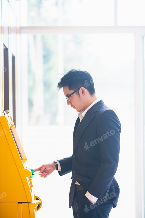 Preview: Businessman Withdraw For Cash At The Atm Machine