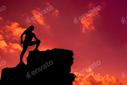 Preview: Silhouette Sporty Woman Climbing On The Cliff. Success And Goal Concept. Strong And Healthy For