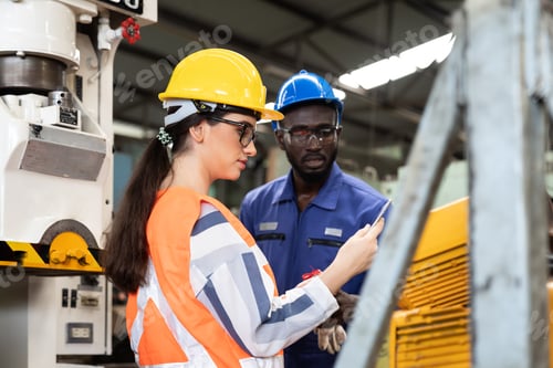 Preview: African American Male And Female Industrial Engineering In Safety Uniform, Hard Hats Working And