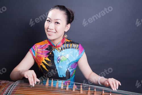 Preview: Girl Sitting And Playing Chinese Zither