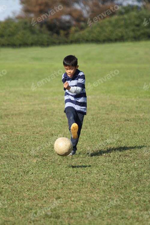 Preview: Japanese Boy Playing With Soccer Ball (Second Grade At Elementary School)