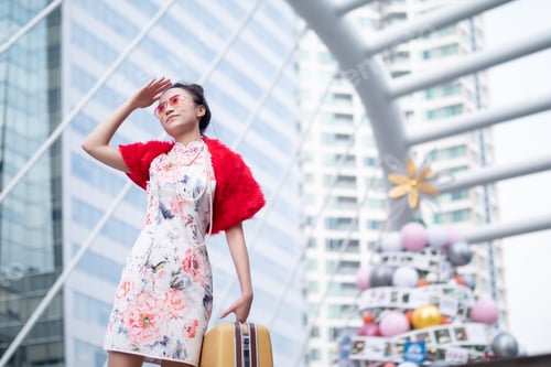 Preview: Portrait Of Asian Woman In Chinese Dress With Luggage In City Centre Bangkok, Thailand. Holiday