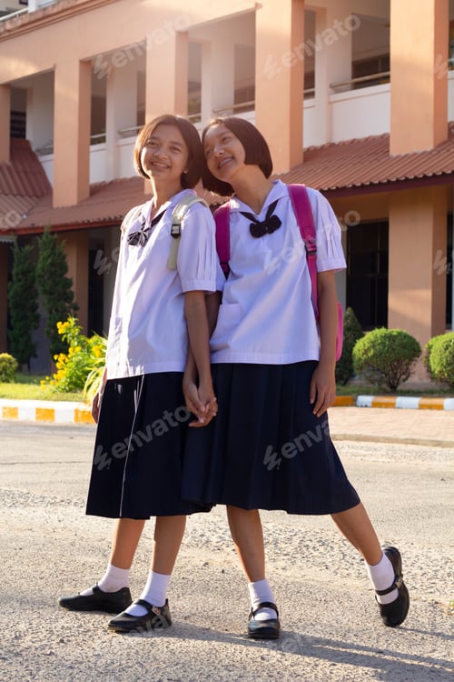 Preview: Portrait Young Asian Girl At School With Uniform.