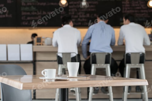 Preview: Blur Or Defocus Image. Asian Businessmen Having Coffee Break In Cafe. For Use As Background