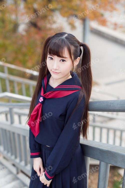 Preview: Beautiful Chinese Female Students In School Uniforms Walking On Campus Learning