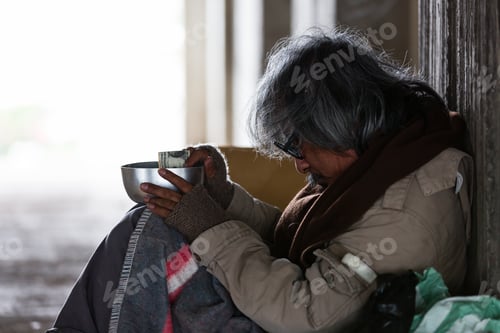 Preview: Homeless Man Sitting Need Money Or Food In An Abandoned Building Or On Street