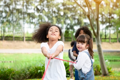 Preview: Children Playing Tug Of War At The Park, Children Are Playing Happily
