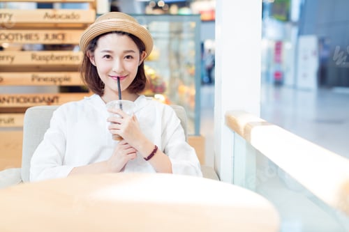 Preview: Beautiful Woman Enjoying Leisure Time In A Shooping Center,Shandong Province,China.