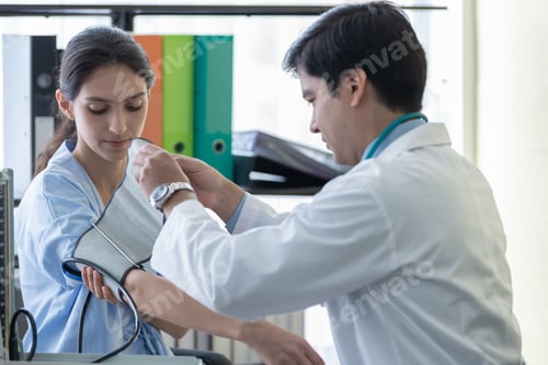 Preview: A Doctor Take Care Of Sick Patient Woman At The Hospital Or Medical Clinic.