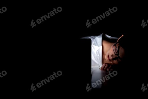 Preview: Woman Working Late At Her Home Office. Beautiful Asian Woman Sleeping On Her Computer, Wearing