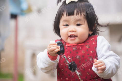 Preview: Portrait Of Cute Baby Playing On The Lawn