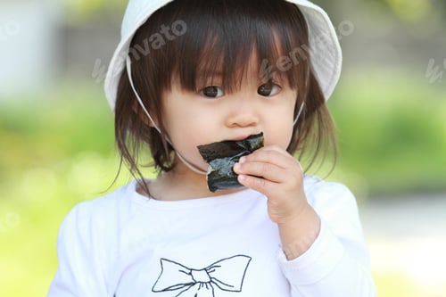 Preview: Japanese Girl Eating Rice Ball (1 Year Old)