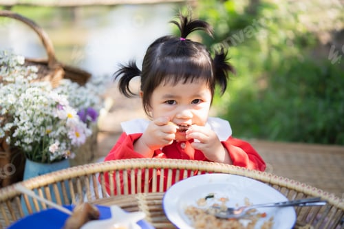Preview: Cute Baby Eating On The Wood Table