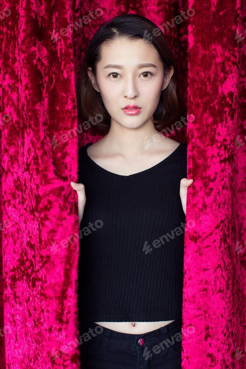 Preview: Portrait Of A Woman In Red Curtain,Looking At Camera.