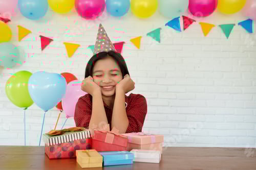 Preview: Blurry Background Young Girl With Many Gift Box At Party.