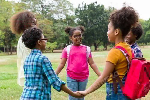 Preview: Group Of African American Children Joining Their Hands In The Park. Diverse Black Children Joining