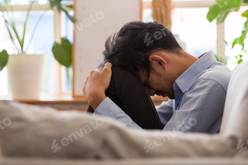 Preview: Stressed Young Asian Man And Put Hands On His Head And Talking With Professional Psychologist While