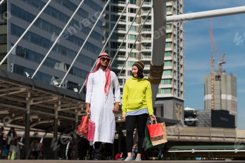 Preview: Arabic Man And Tourist Woman Shopping In City