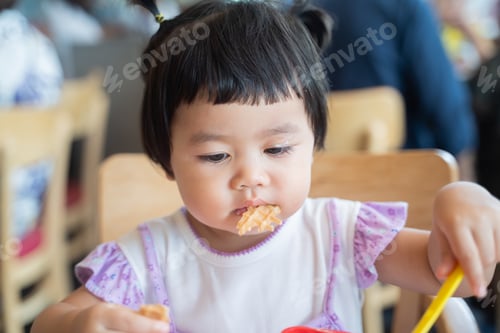Preview: Cute Baby Eating Ice Cream At The Restaurant
